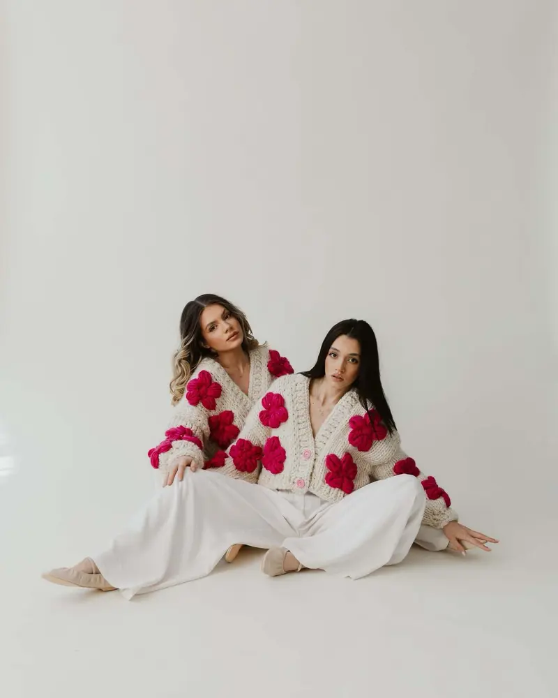 Cream floral wool sweater with dark pink flowers